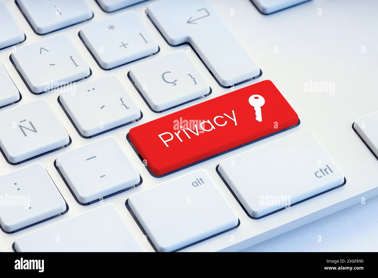 Parola di privacy e icona del tasto sulla tastiera rossa del computer Foto Stock