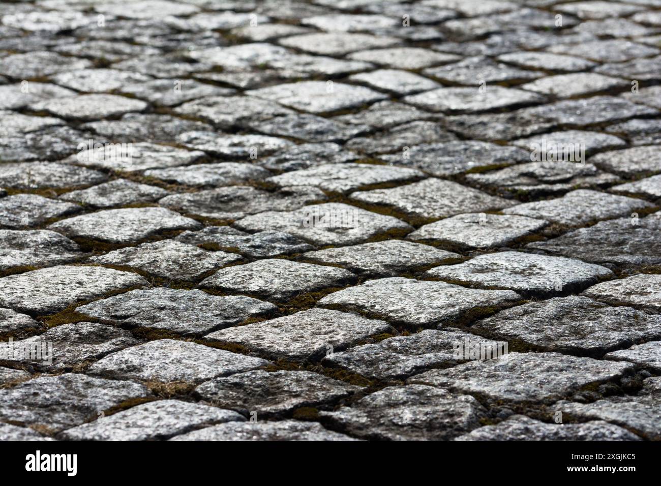 Nahaufnahme von Pflasterfläche aus Naturstein. Foto Stock