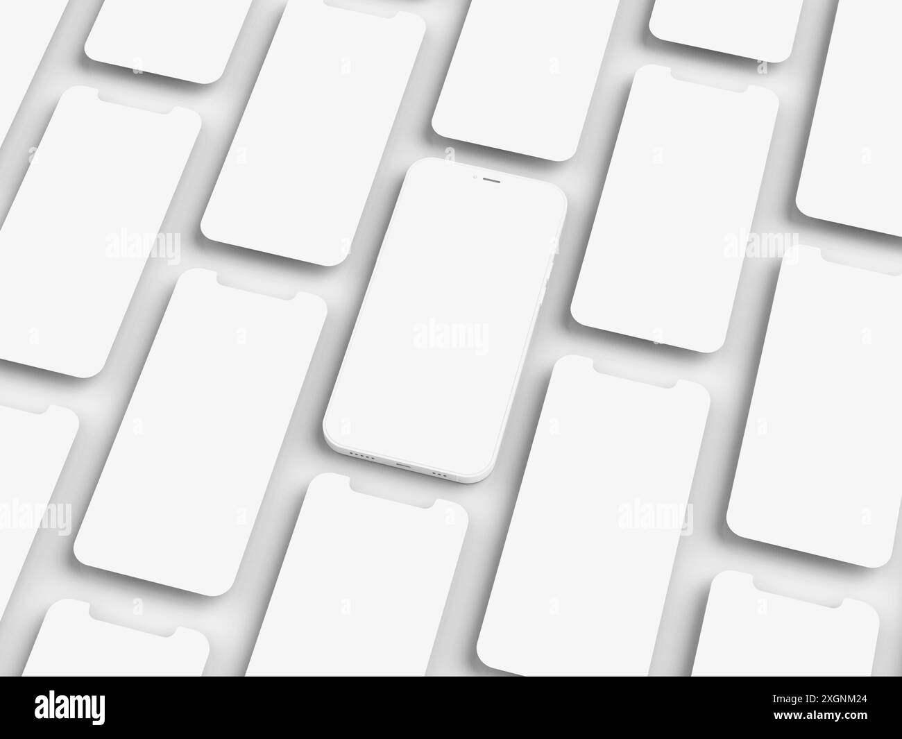 Vista dall'alto di più smartphone bianchi disposti in griglia, che enfatizza minimalismo e uniformità Foto Stock