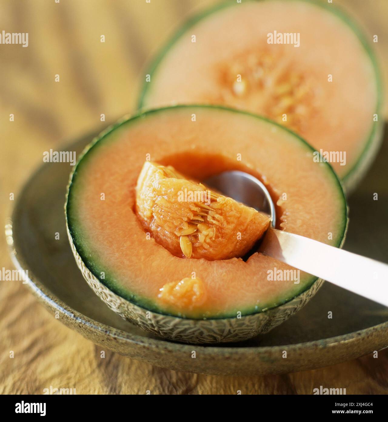 Togliendo i pappagalli dal melone Foto Stock