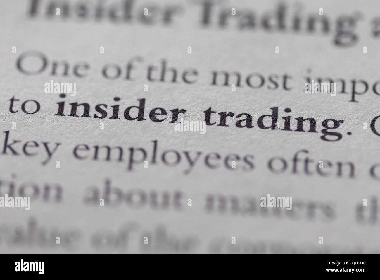 insider trading stampato in testo a pagina come supporto visivo o riferimento al diritto commerciale Foto Stock