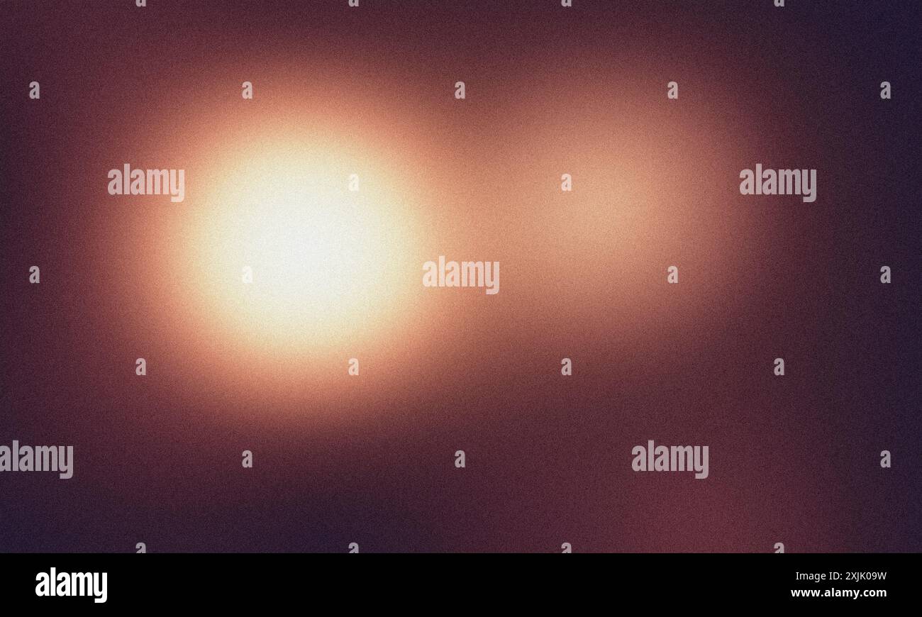 Due luci brillano su uno sfondo granuloso Foto Stock