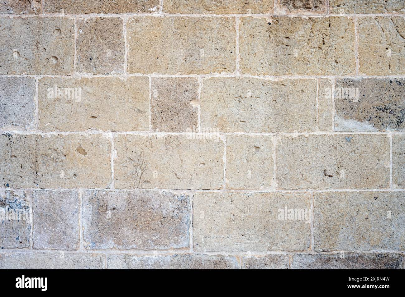 Sfondo da un muro fatto di grandi pietre naturali Foto Stock