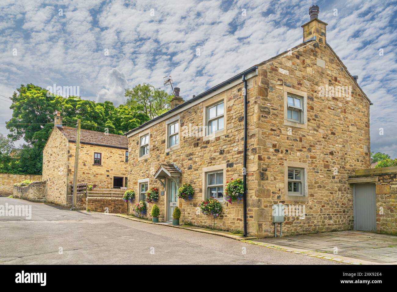 Case tipiche nel villaggio di Addingham nello Yorkshire occidentale Foto Stock