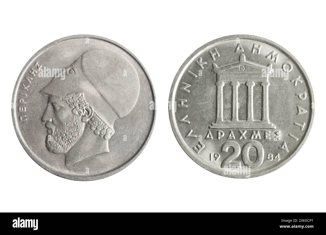 Foto isolata di 20 monete greche da 1984 dracme rame-nichel della terza Repubblica ellenica su sfondo bianco. Foto Stock