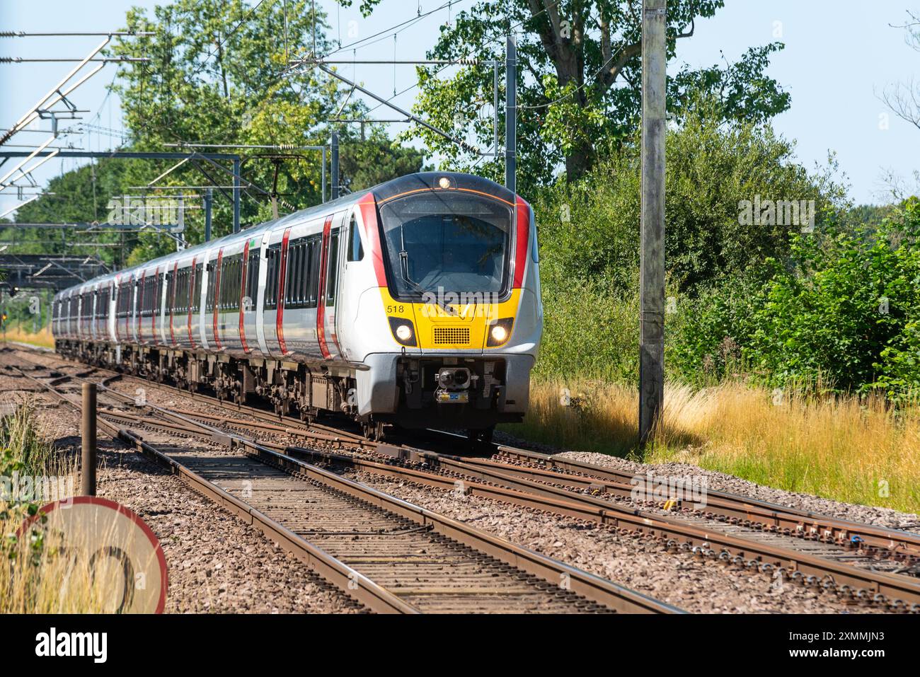 Greater Anglia British Rail Class 720 Aventra treno della Greater Anglia passando per Margaretting verso Clacton on Sea, Regno Unito. Ferrovia moderna Foto Stock