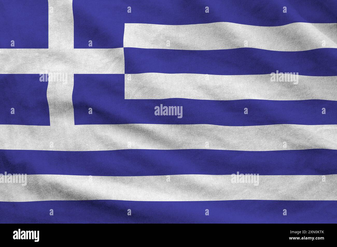 Bandiera greca raffigurata su tessuto ondulato piegato di vecchio panno primo piano Foto Stock