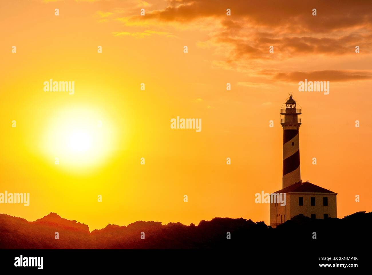 Faro di Capo Favaritx al tramonto, Cap de Favàritx, Minorca, riserva della biosfera, Isole Baleari, Spagna Foto Stock