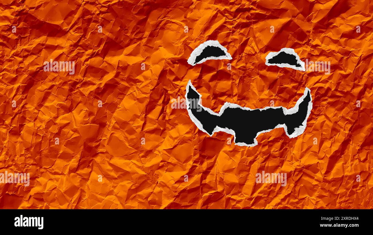 Sfondo di Halloween come un mestiere di carta, Jack-o-Lantern, zucca delle feste autunnali, simbolo stagionale delle feste autunnali, realizzato in cartone strappato Foto Stock