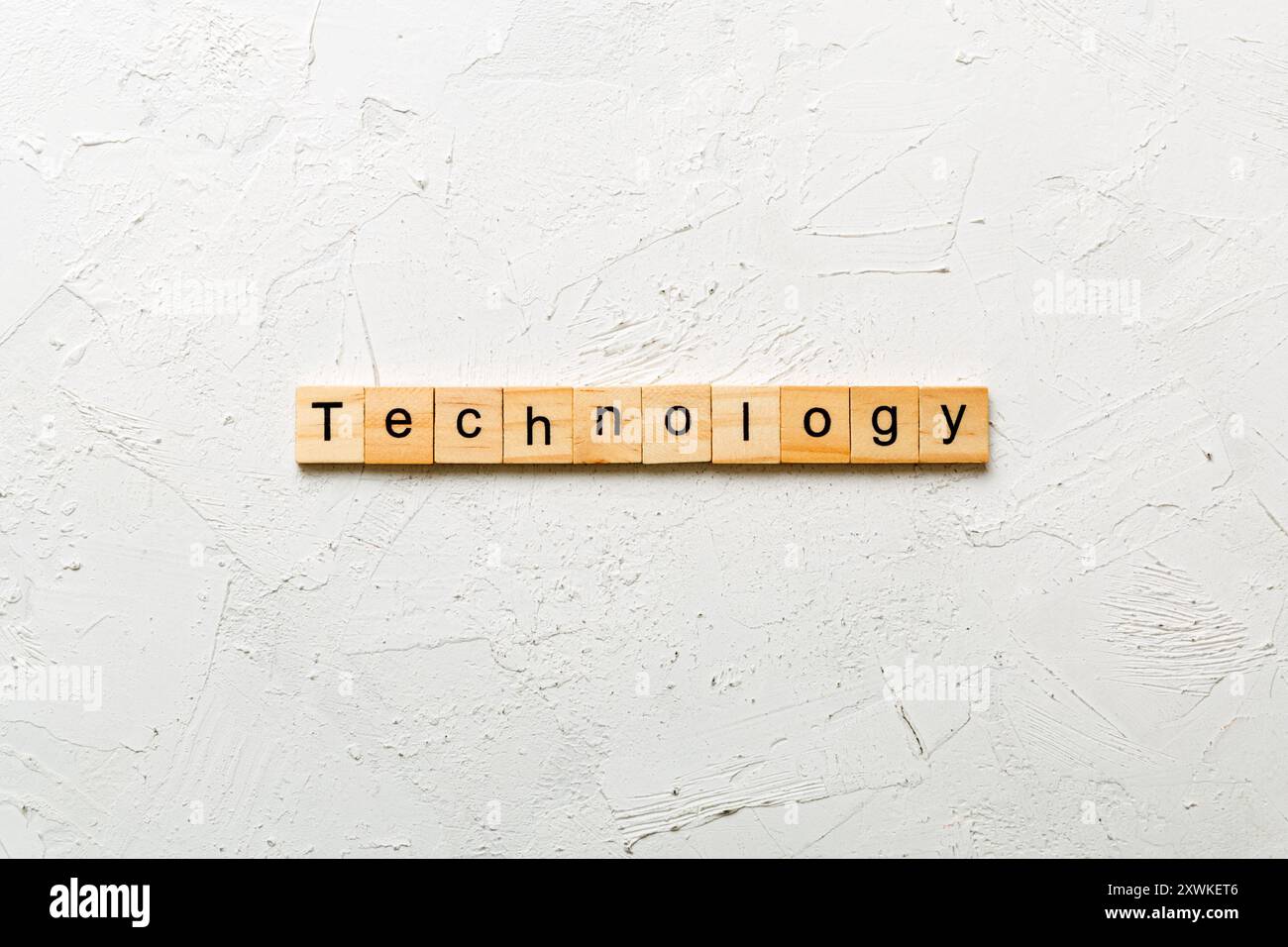 La tecnologia parola scritta sul blocco di legno. La tecnologia del testo in tabella, concetto. Foto Stock