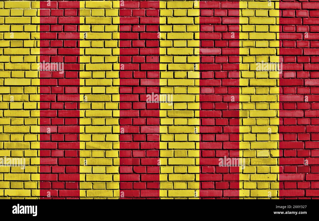 Bandiera della Northumbria dipinta su un muro di mattoni Foto Stock