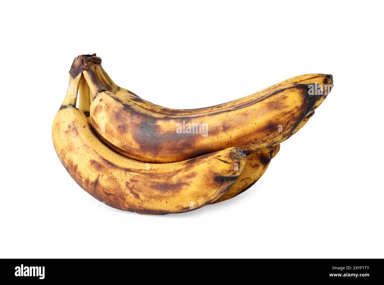 Mucchio di banane mature con macchie scure isolate su bianco Foto Stock