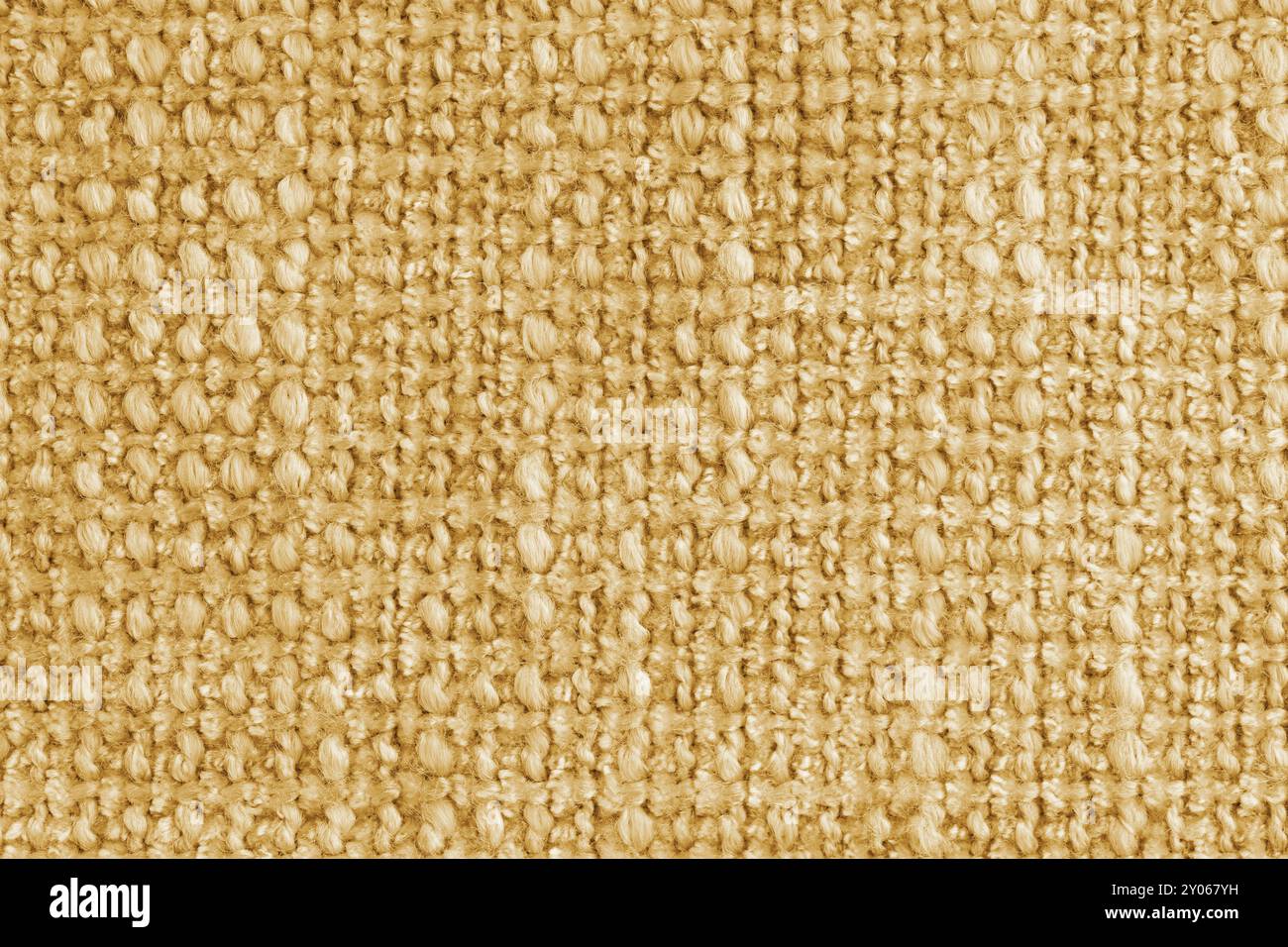 Trama di tessuto jacquard giallo di tessuto ruvido, sfondo struttura in tessuto, primo piano, macro. Materiale per tessuti per la casa, tappezzeria e decorazioni per tende Foto Stock