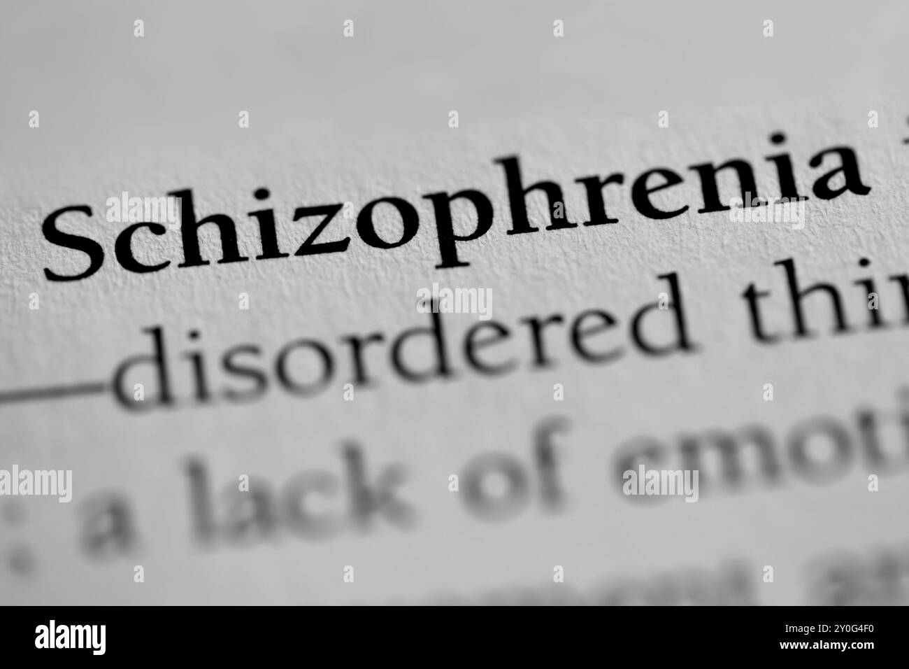 Primo piano della parola "schizofrenia" nel libro di testo di psicologia Foto Stock
