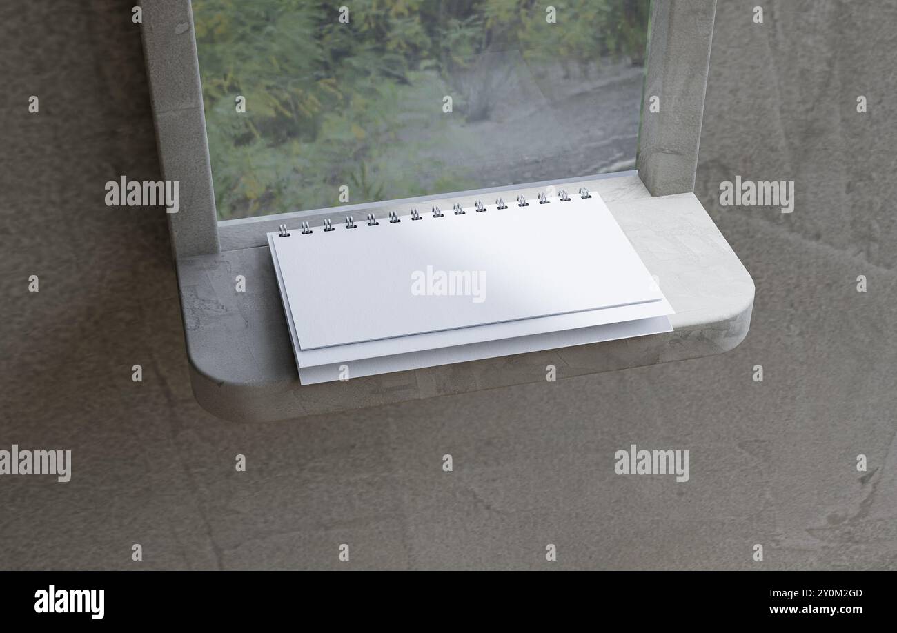 Un calendario a spirale aperto su una sporgenza Foto Stock