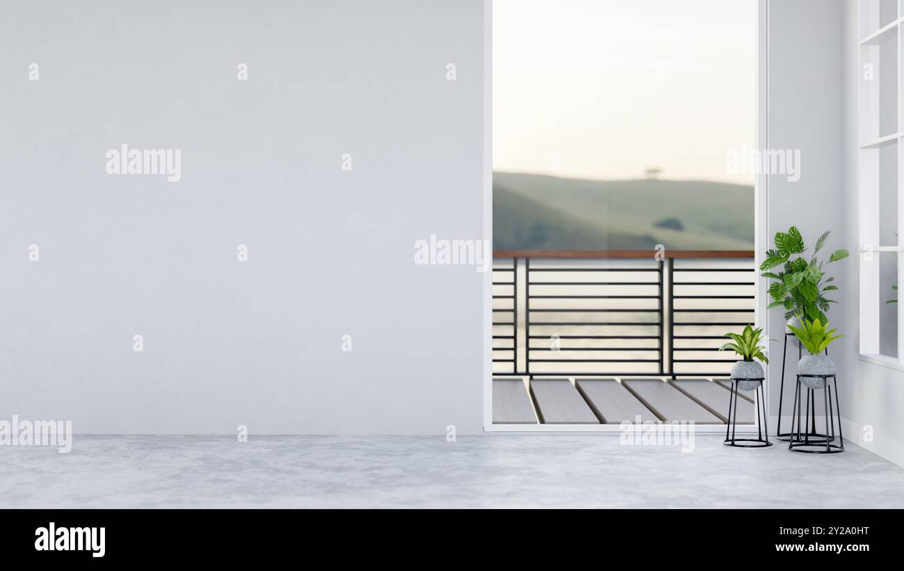 Il design degli interni di una moderna camera vuota e non arredata presenta una parete bianca vuota, piante d'appartamento, una finestra con vista del balcone e un pavimento grigio. Foto Stock