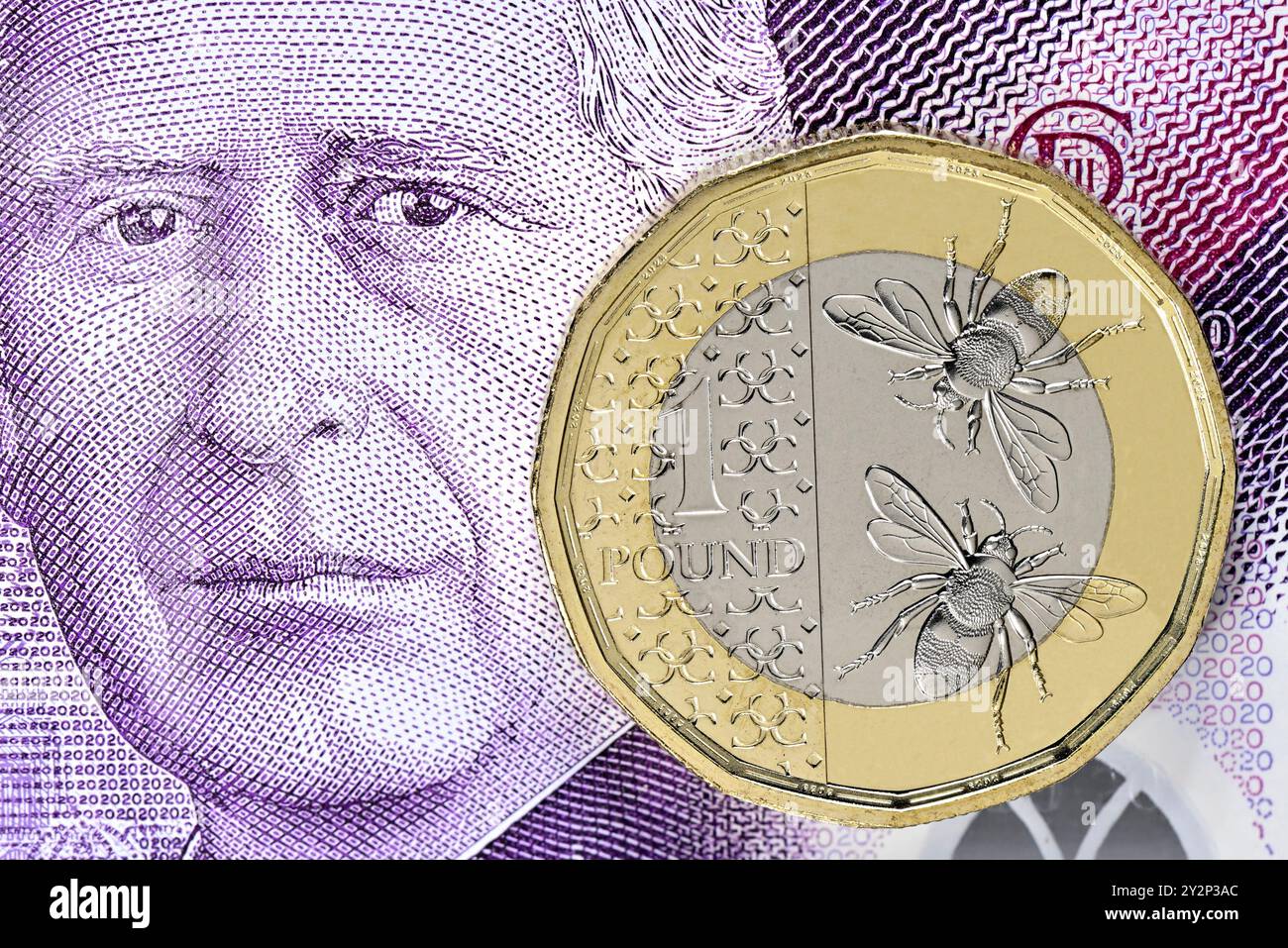 Charles III curency britannico - banconota da 20 sterline e moneta da 1 sterline Foto Stock