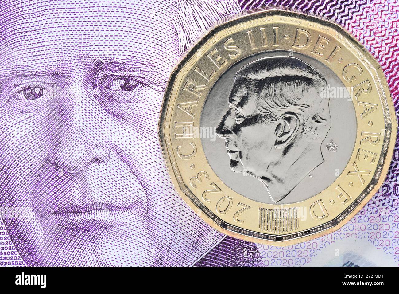 Charles III curency britannico - banconota da 20 sterline e moneta da 1 sterline Foto Stock