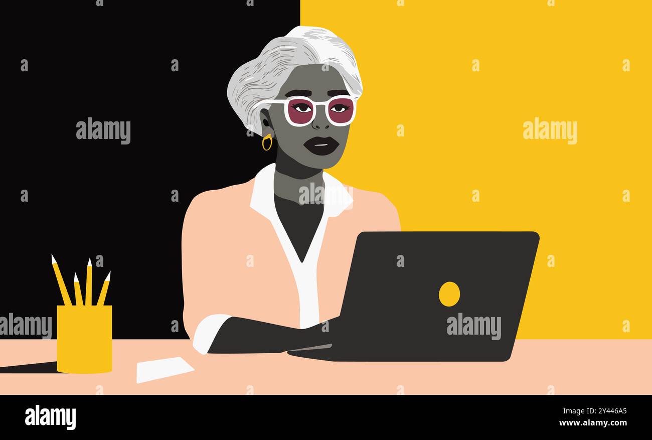 Una donna è seduta a una scrivania con un portatile di fronte Foto Stock