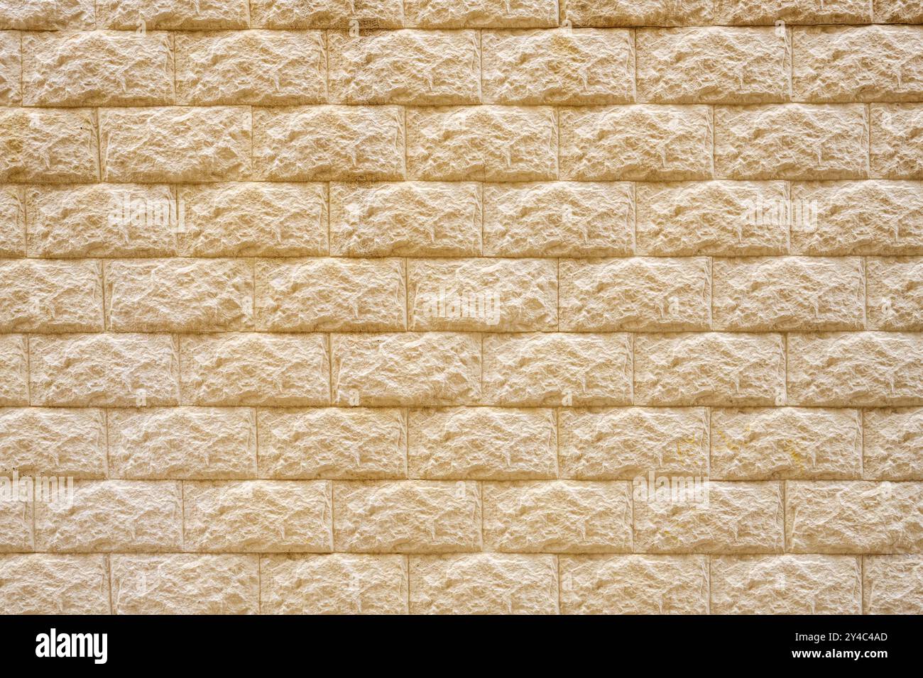 Sfondo di un vecchio muro di mattoni beige Foto Stock