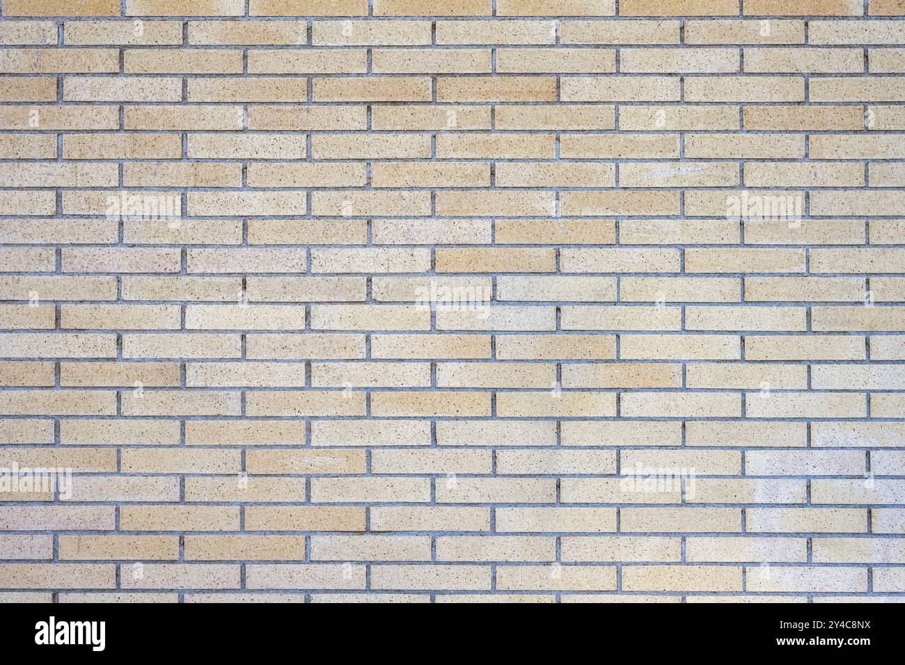 Sfondo di un muro di mattoni in clinker beige Foto Stock