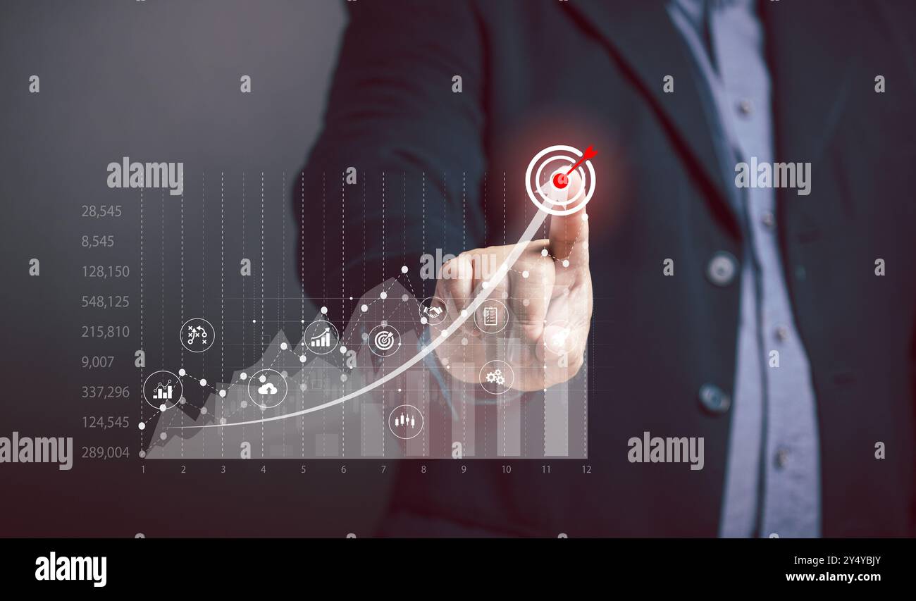 I punti dell'uomo d'affari si riferiscono al grafico sullo schermo virtuale, alla crescita aziendale, al punto di taglio massimo dei profitti, al trading in borsa. Affari, finanza e marketi Foto Stock