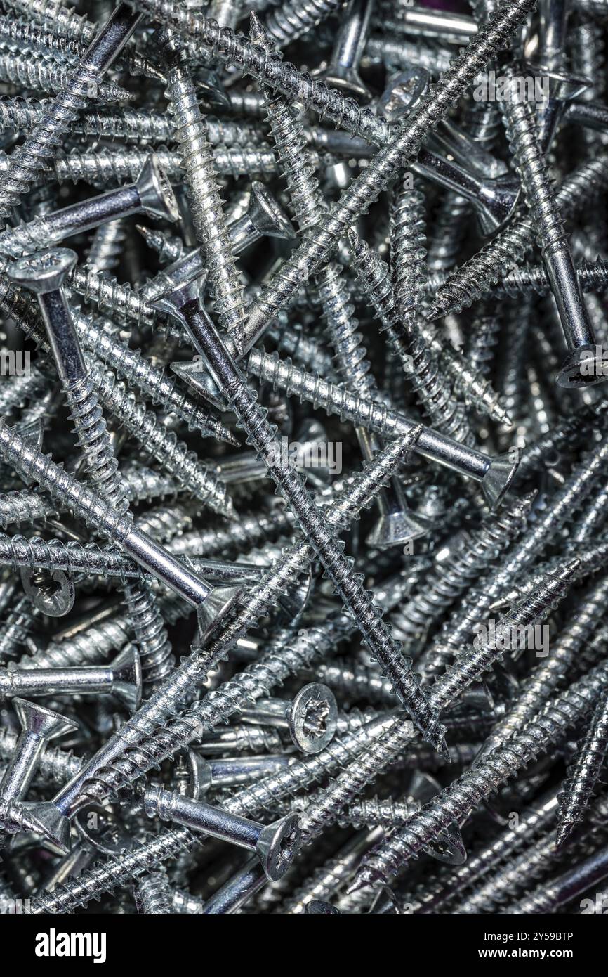 Viti di legno di acciaio accatastate Foto Stock