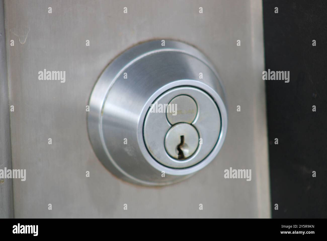 serratura rotonda argento con foro per chiavetta Foto Stock