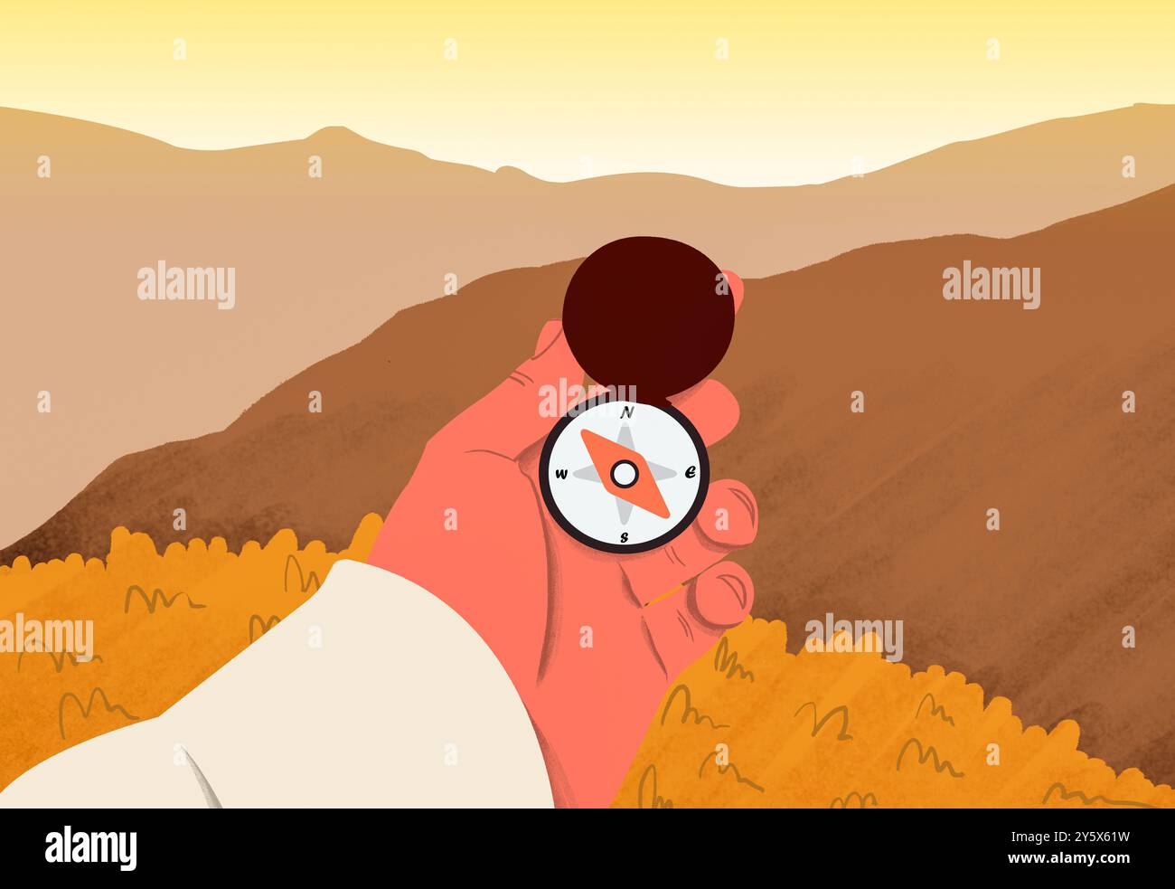 Una mano regge una bussola su uno sfondo panoramico di colline dorate sotto un cielo morbido e gradiente. Foto Stock