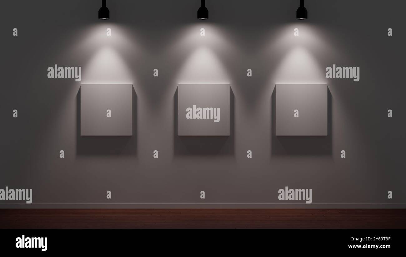 Tre tele vuote illuminate drammaticamente in una galleria d'arte moderna con una parete bianca e un pavimento in legno. Foto Stock