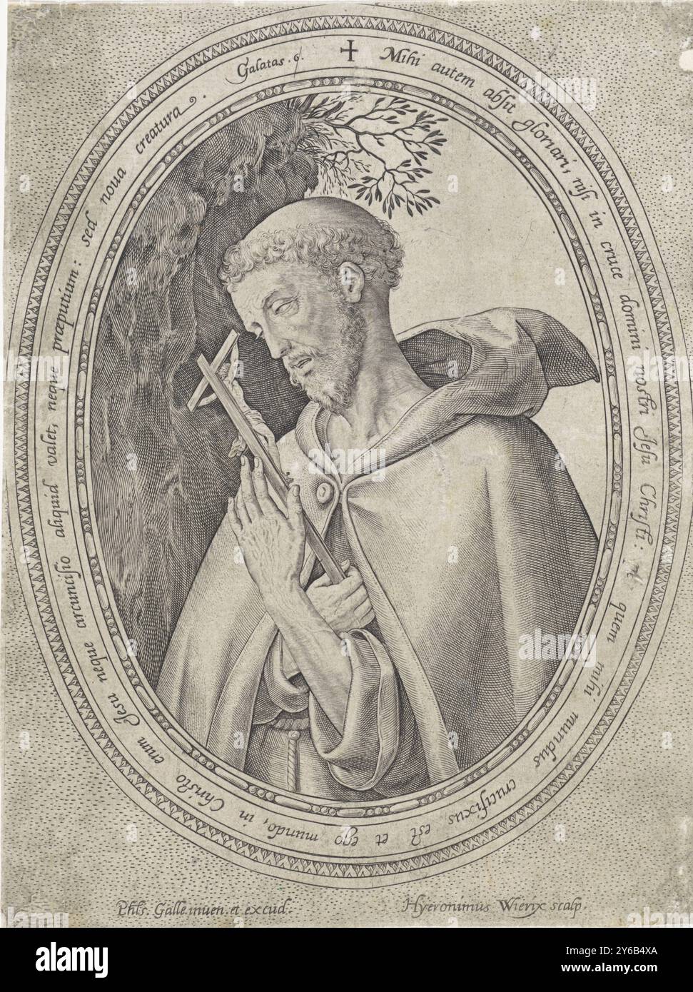 San Francesco d'Assisi, San Francesco d'Assisi, in abitudine, vicino ad una roccia. Nelle sue mani ha un crocifisso. La scena è contenuta in una cornice ovale in cui una citazione biblica di Gal. 6 in latino., stampa, stampatore: Hieronymus Wierix, (menzionato sull'oggetto), dopo il design di: Philips Galle, (menzionato sull'oggetto), editore: Philips Galle, (menzionato sull'oggetto), Anversa, 1563 - prima del 1612, carta, incisione, altezza, 195 mm x larghezza, 147 mm Foto Stock