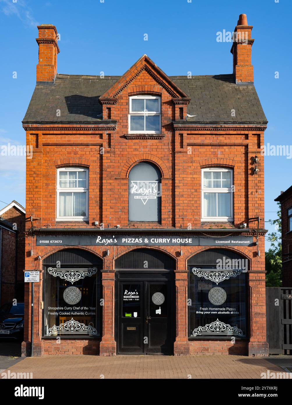 Raza's Pizza and Curry House, Craven Arms, Shropshire. Nella foto di maggio 2024. Foto Stock