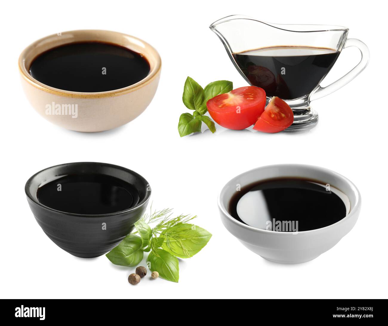 Gustoso aceto balsamico su sfondo bianco, set Foto Stock