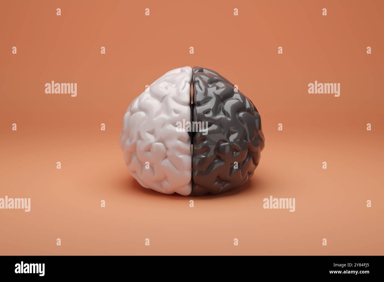 Cervello umano mezzo nero e mezzo bianco isolato su sfondo arancione. illustrazione 3d. Foto Stock