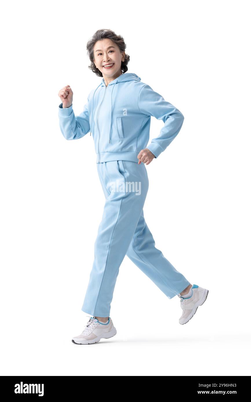 Donna anziana felice che fa sport Foto Stock
