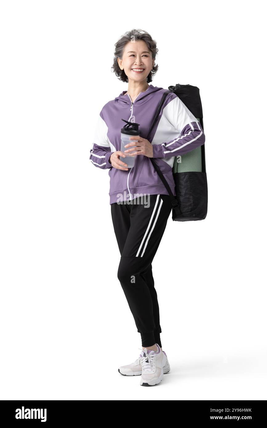 Donna anziana felice che fa sport Foto Stock