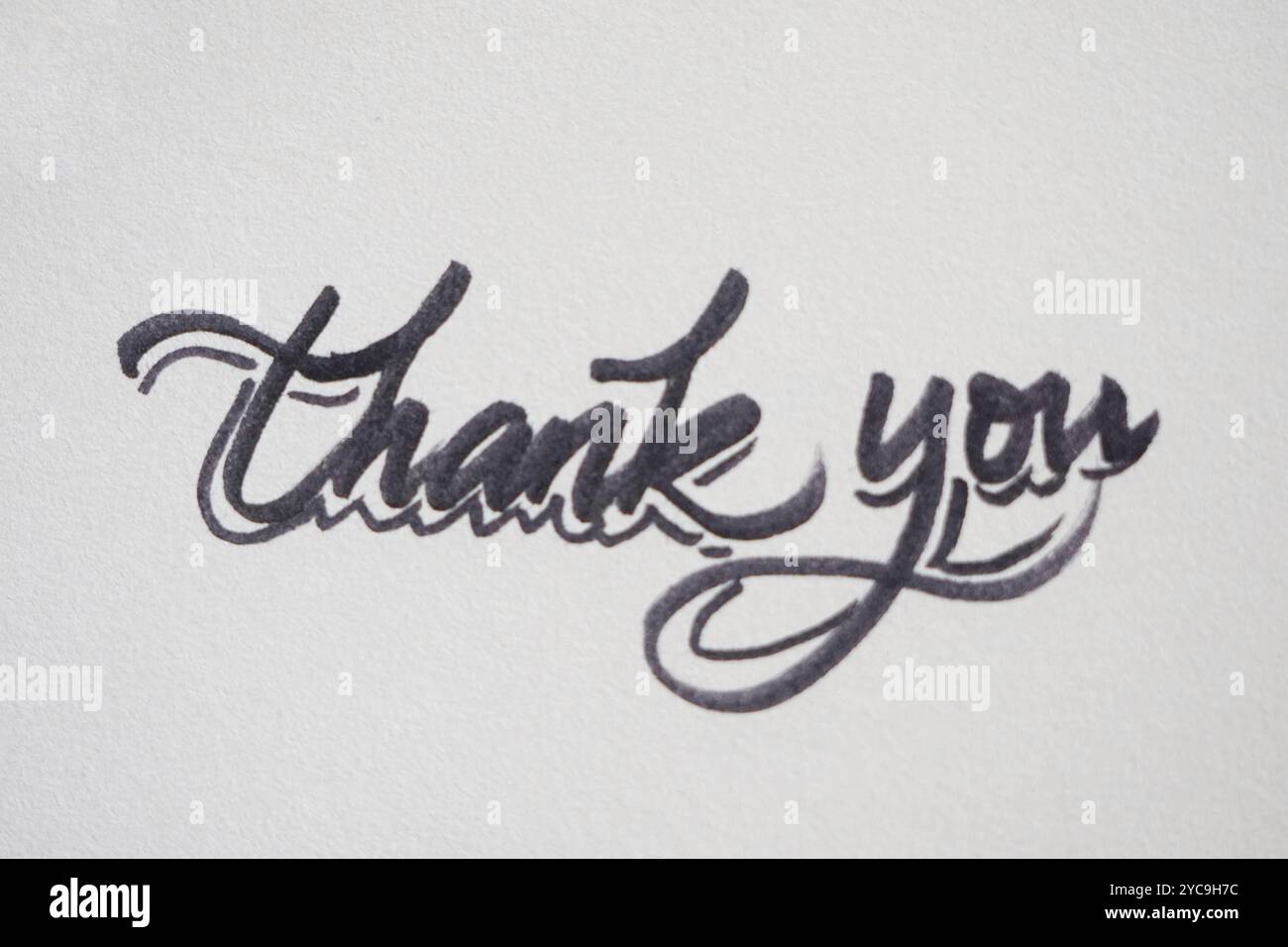 Nota di ringraziamento scritta a mano su un white paper Foto Stock