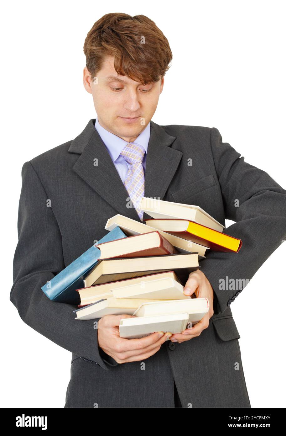 Lo studente porta in mano una grande pila di libri di testo Foto Stock