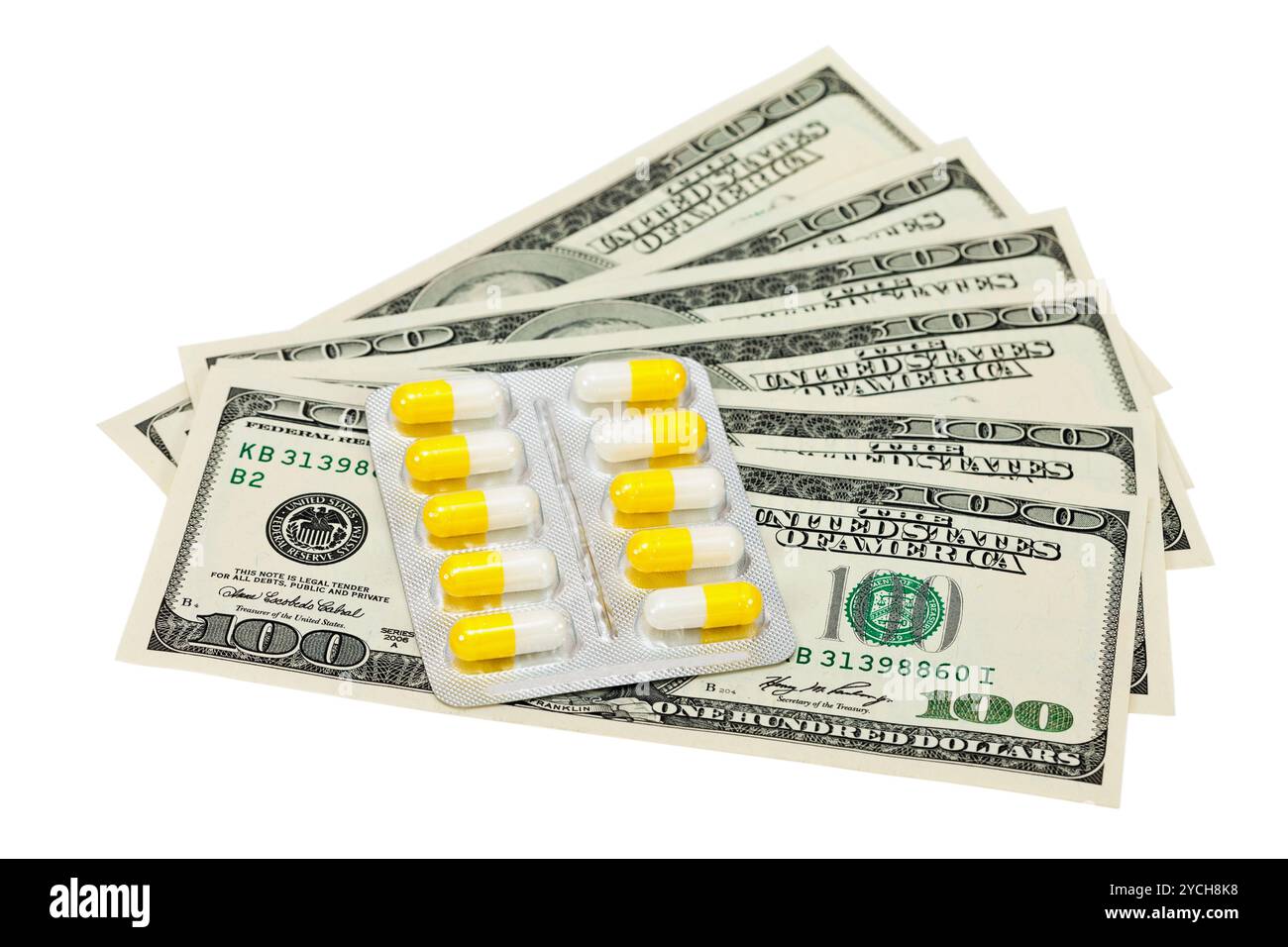 Pillole e denaro su sfondo bianco Foto Stock