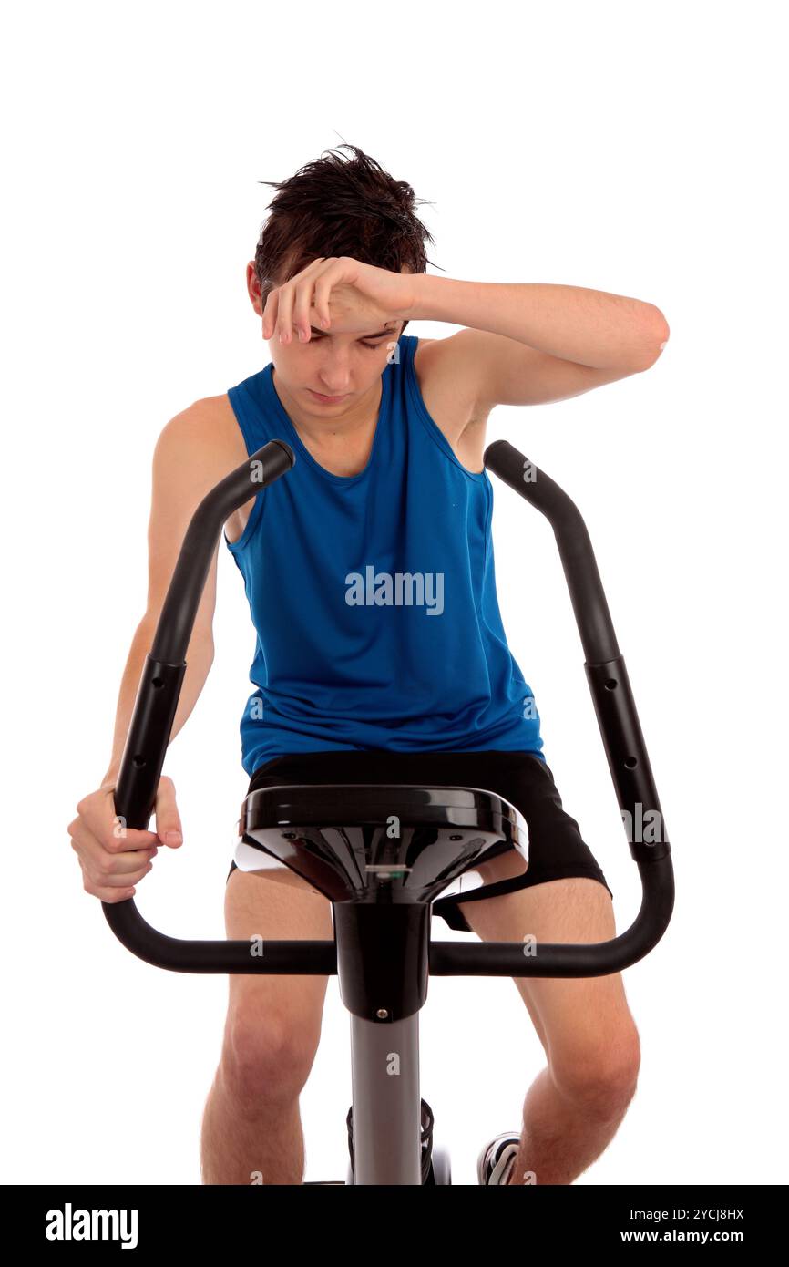 Esaurito dopo allenamento sulla cyclette Foto Stock