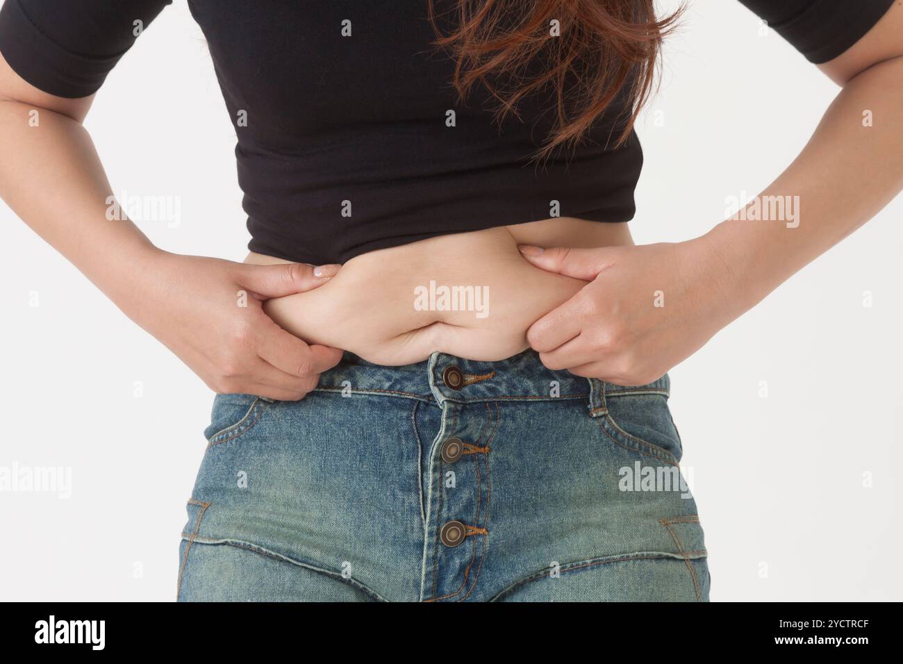 Lo stomaco di una donna di mezza età Foto Stock