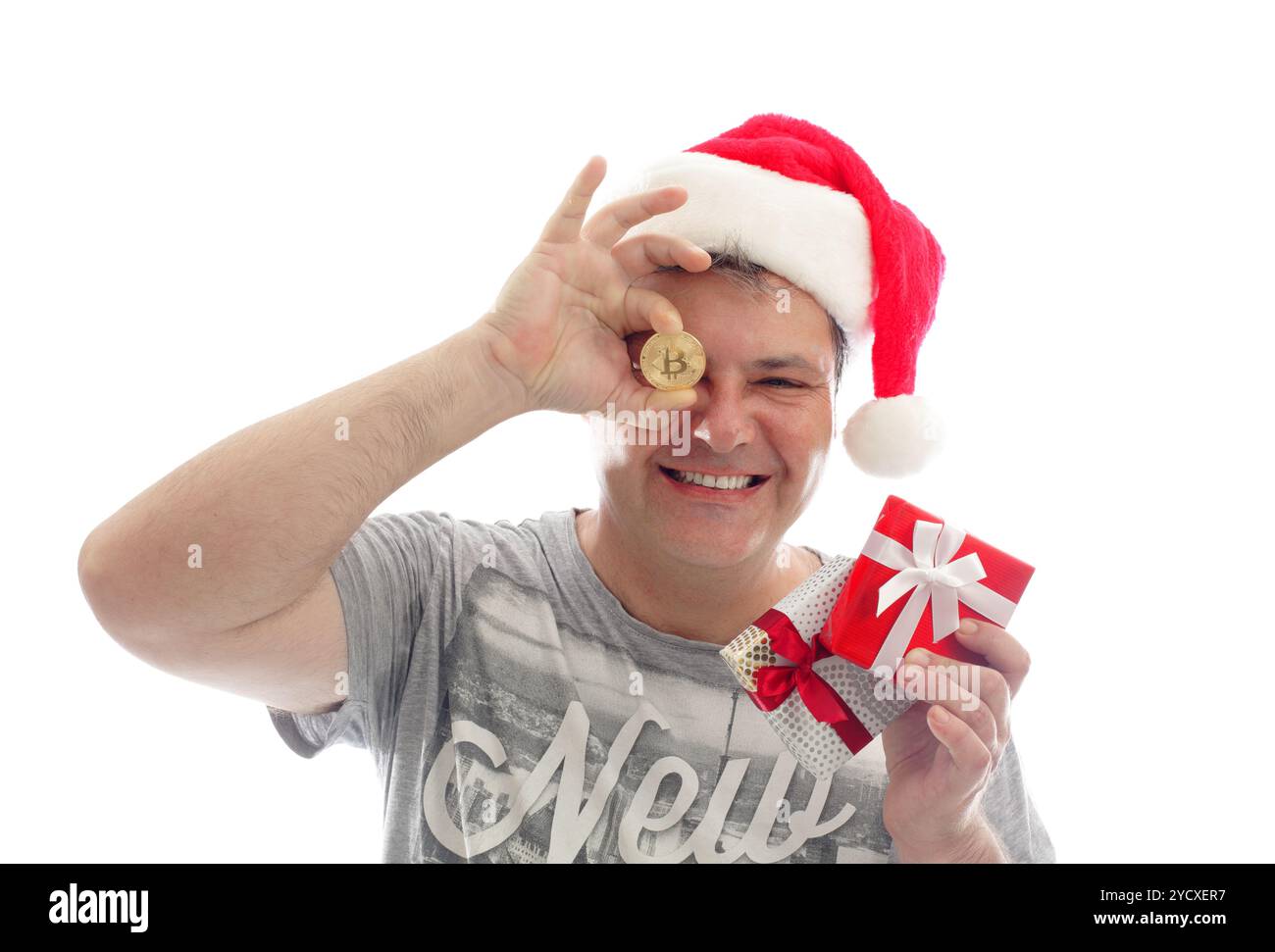 Crypto Christmas - uomo con Bitcoin Foto Stock