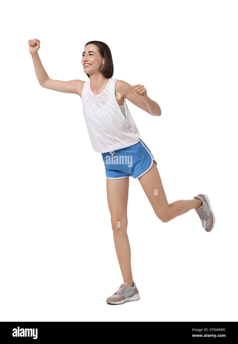 Bella donna in abbigliamento sportivo che corre su sfondo bianco Foto Stock