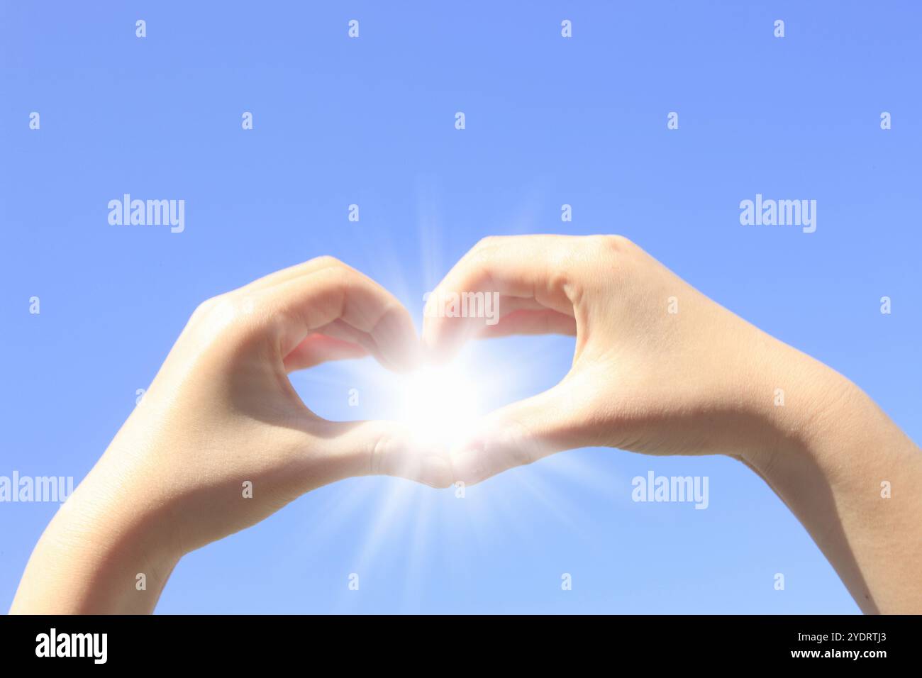 Simbolo del cuore e sole Foto Stock