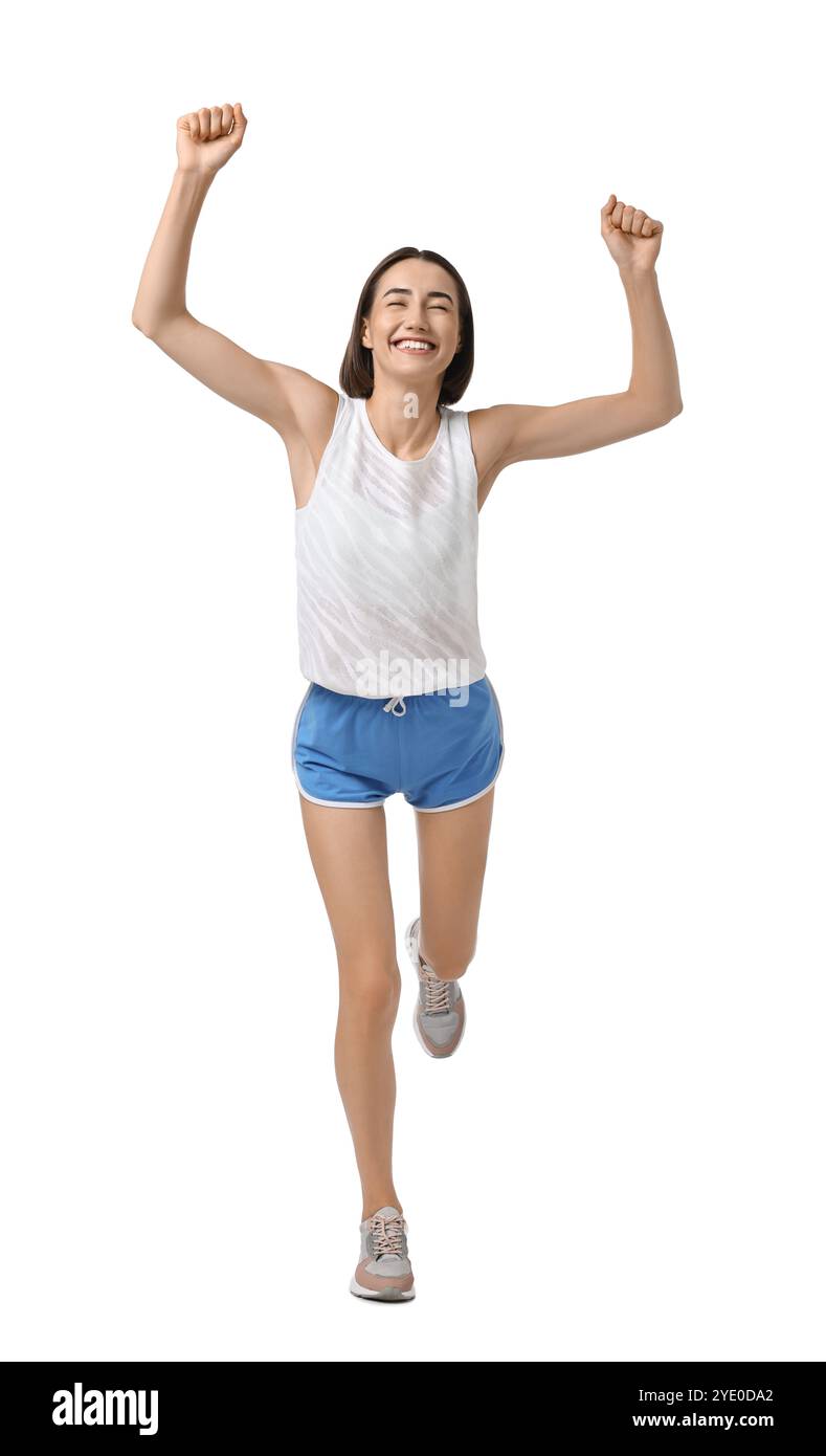 Bella donna in abbigliamento sportivo che corre su sfondo bianco Foto Stock