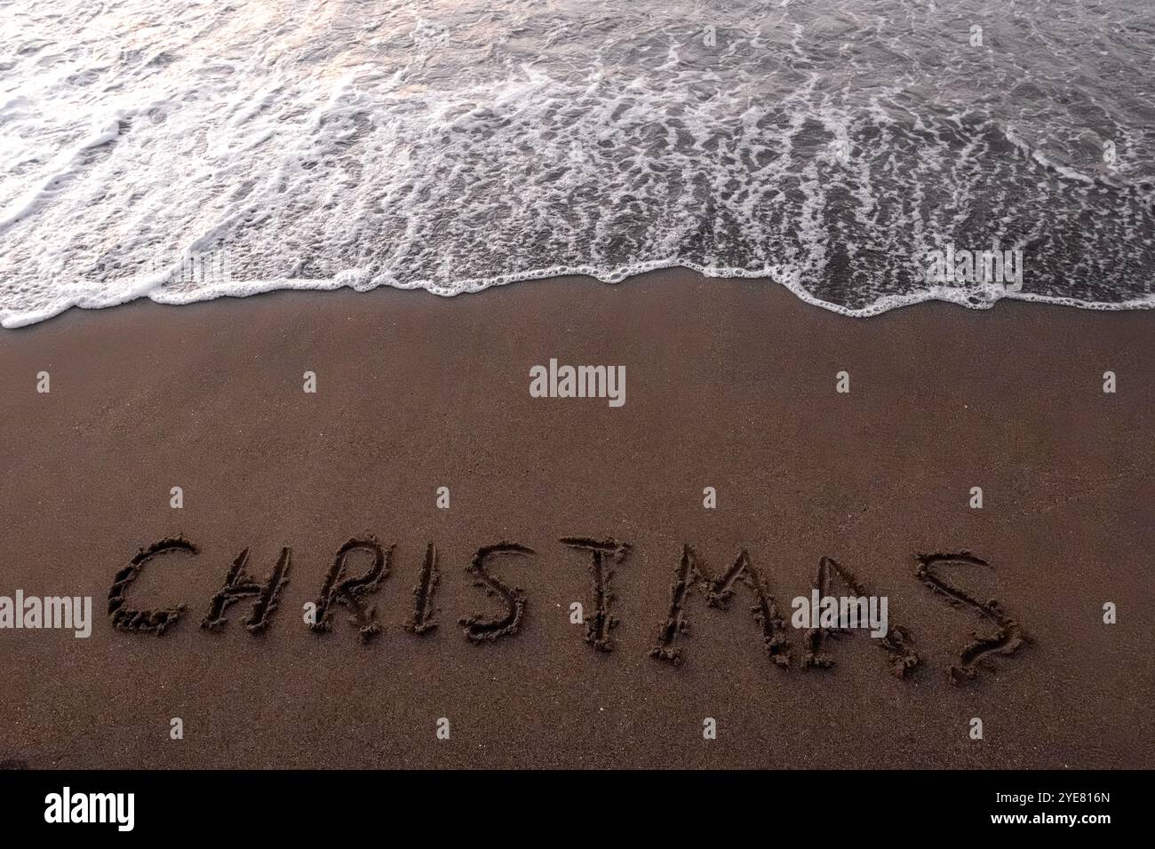 Iscrizione di Natale 2005 sulla spiaggia estiva Foto Stock