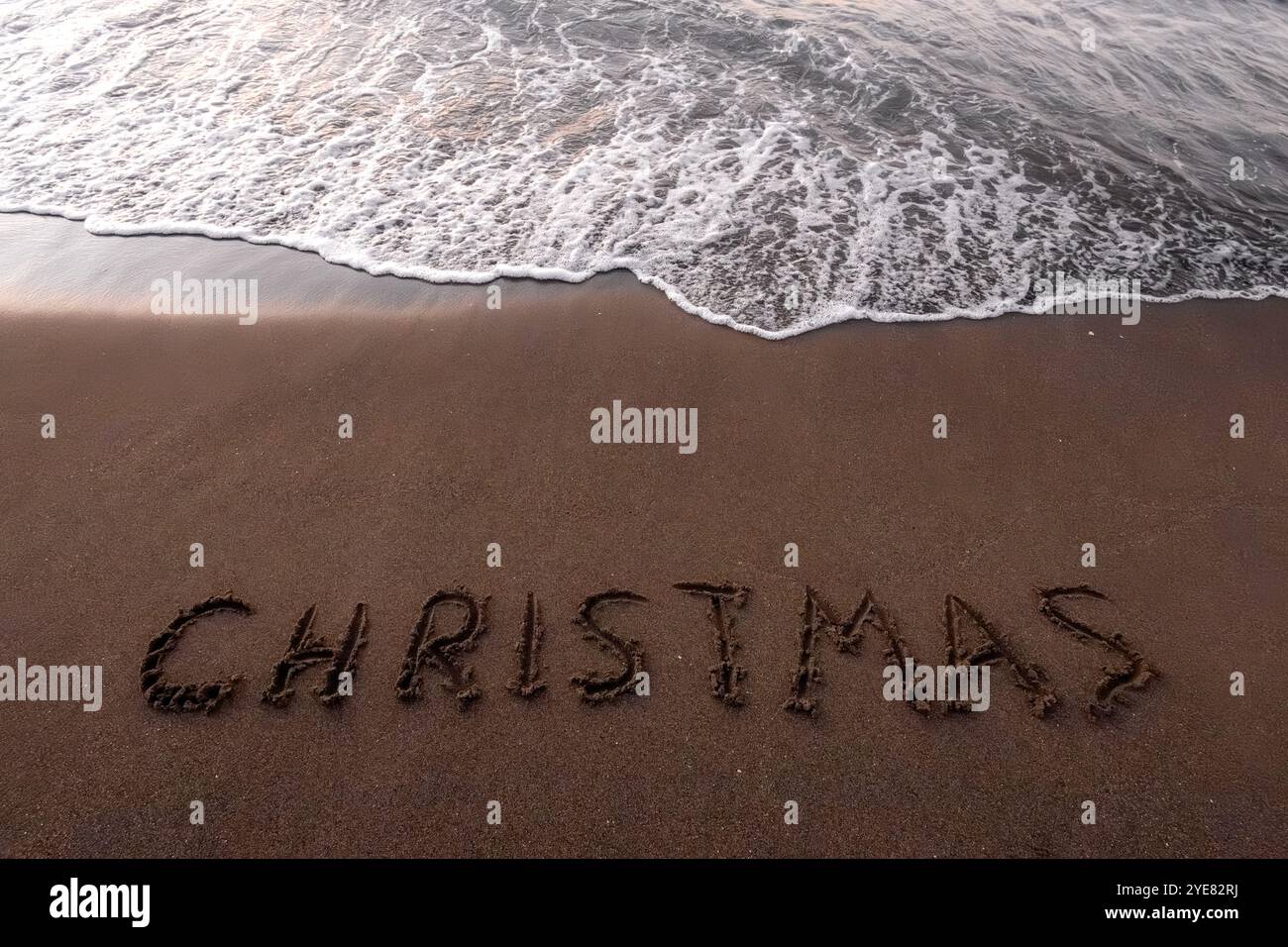 Iscrizione di Natale 2005 sulla spiaggia estiva Foto Stock