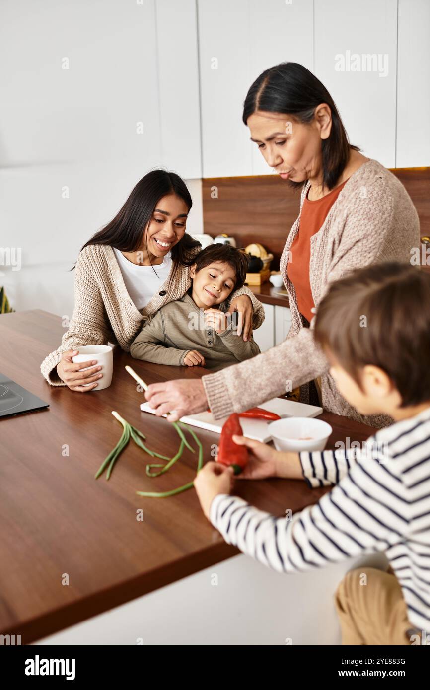 Una famiglia asiatica felice ama cucinare insieme, con bambini che aiutano gli adulti prima di Natale. Foto Stock