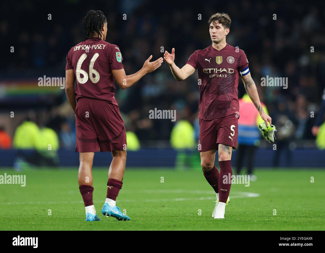 Londra, Regno Unito. 30 ottobre 2024. Jahmai Simpson-Pusey di Manchester City (a sinistra) e John Stones di Manchester City (a destra) dopo la partita della Carabao Cup al Tottenham Hotspur Stadium di Londra. Credito immagine dovrebbe essere: Kieran Cleeves/Sportimage Credit: Sportimage Ltd/Alamy Live News Foto Stock