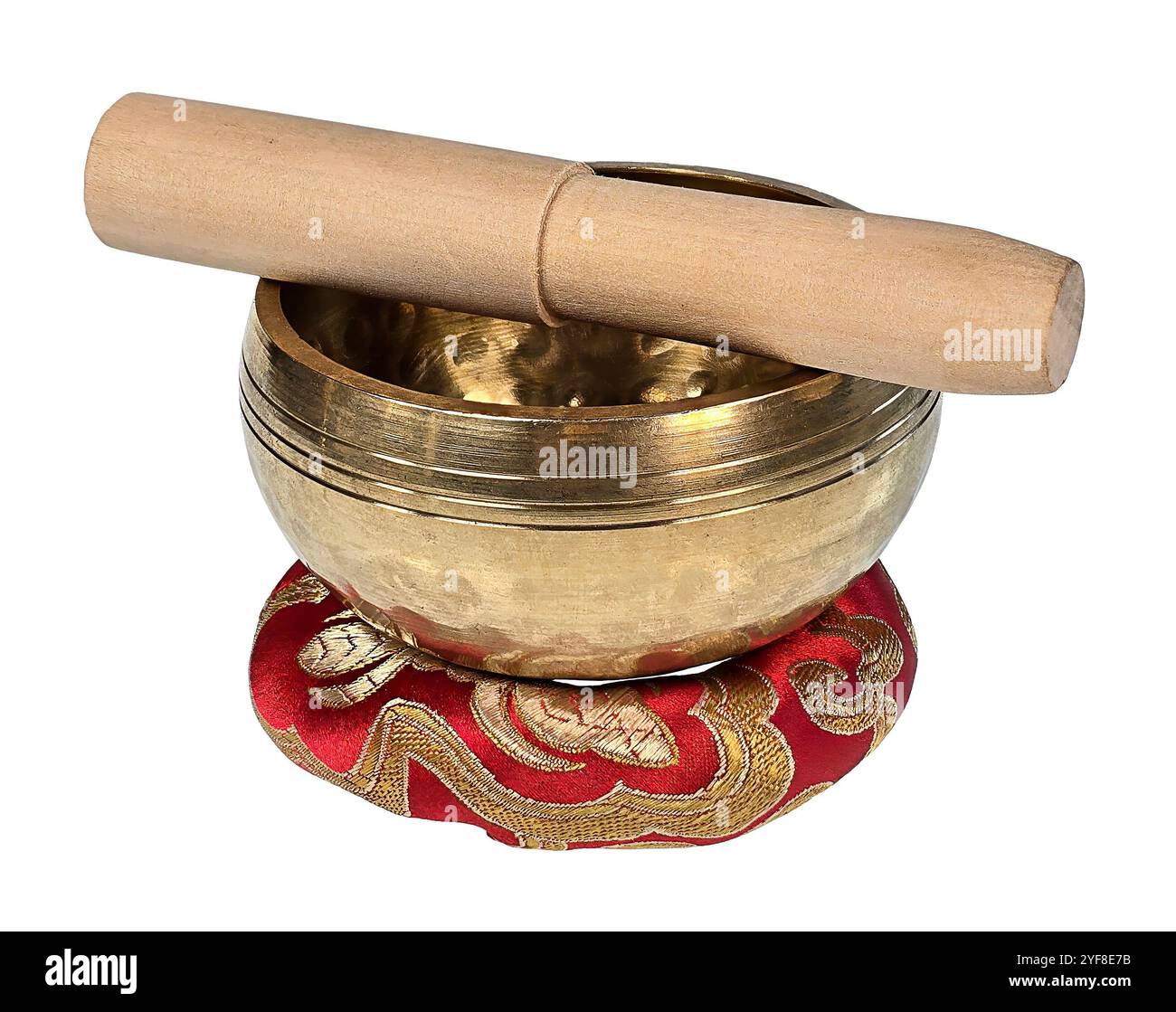 Ciotola tibetana in ottone con soffice e cuscino rosso Foto Stock